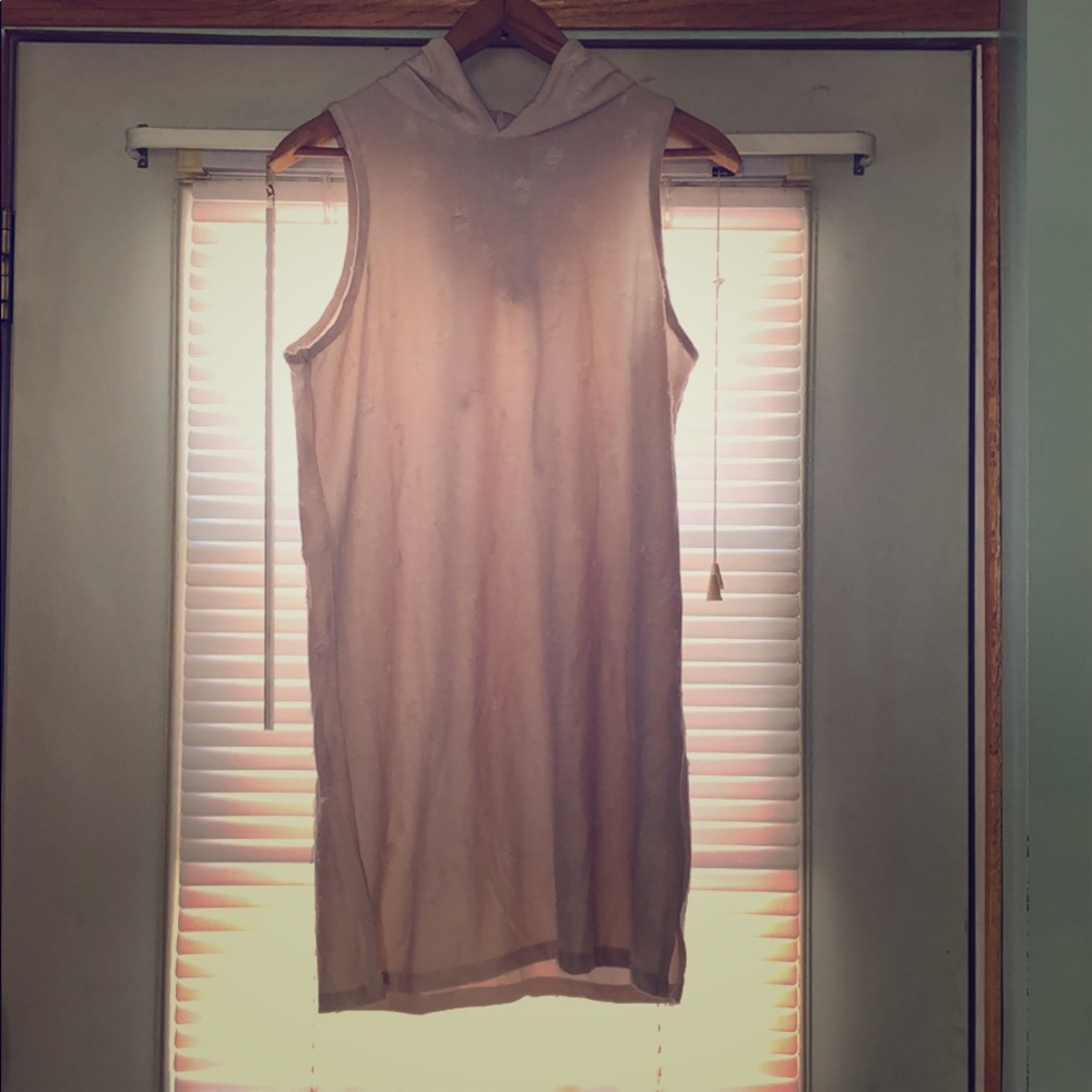 Light pink sleeveless sweater with hood.